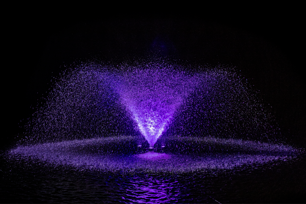 Otterbine MIDI-RGBW fountain featuring striking purple light display at night