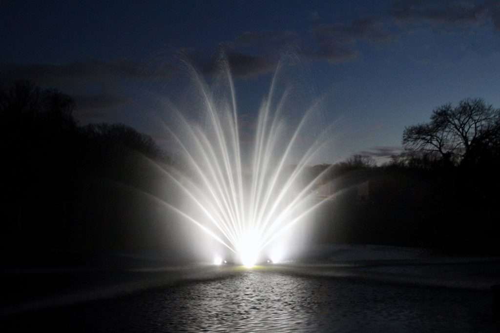 White illuminated RGBW fountain display at night in Australia